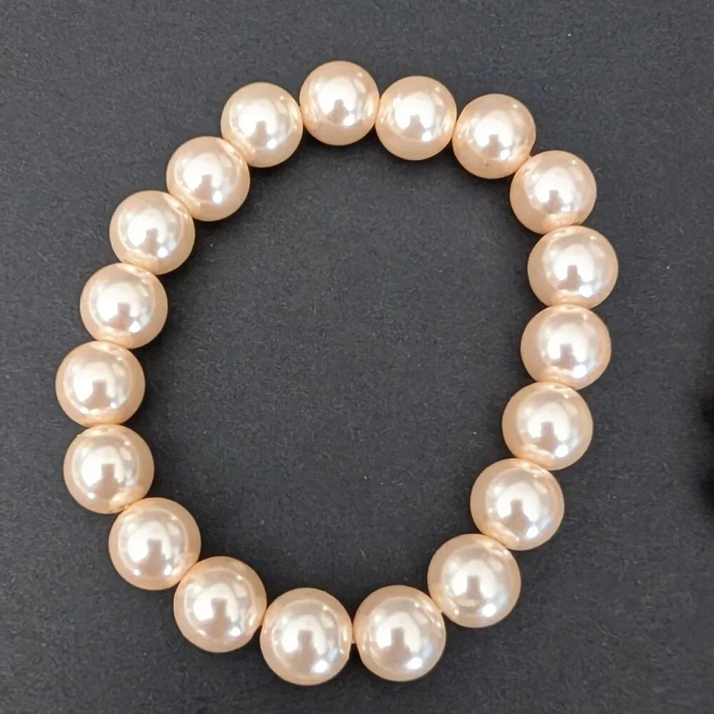 Bundle of nude and natural beaded stretch bracelets